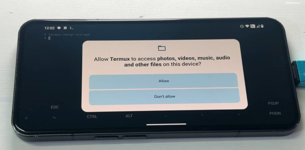 A smartphone displaying a permission request from the Termux app
